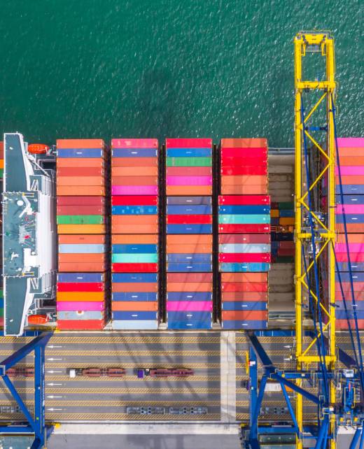 Container ship loading and unloading in deep sea port, Aerial to Container ship loading and unloading in deep sea port, Aerial top view of business logistic import and export freight transportation by container ship in open sea.